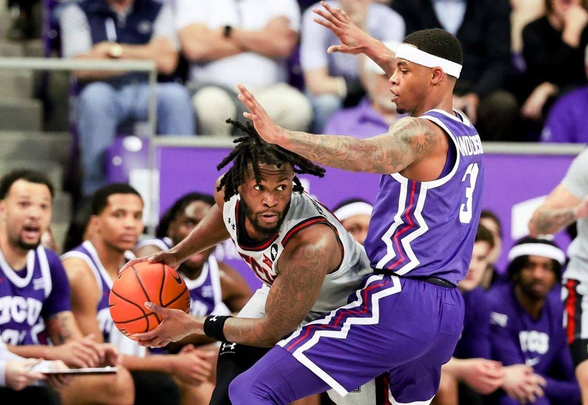 Jan 30, 2024; Fort Worth, Texas, USA;  Texas Tech Red Raiders guard Joe Toussaint (6) looks to pass as TCU Horned Frogs guard Avery Anderson III (3) defends during the first half at Ed and Rae Schollmaier Arena.