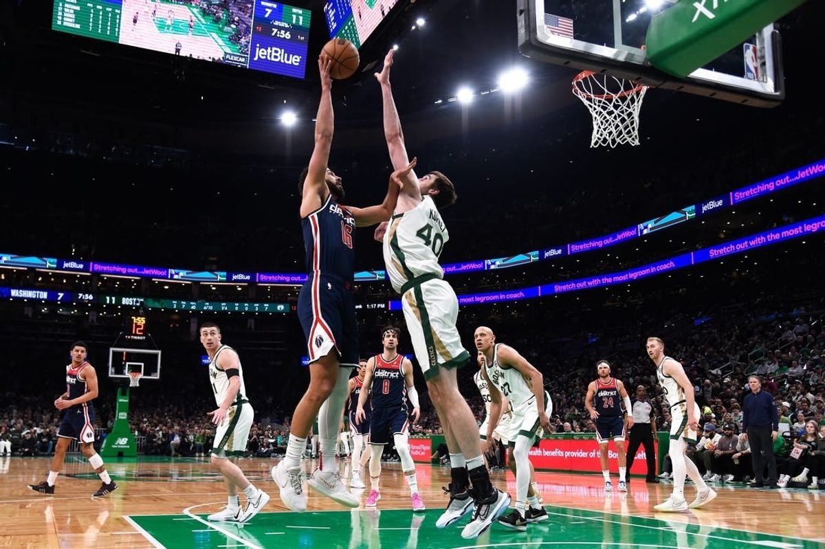 Apr 14, 2024; Boston, Massachusetts, USA;  Boston Celtics center Luke Kornet (40) blocks the shot of Washington Wizards forward Anthony Gill (16) during the first half at TD Garden.