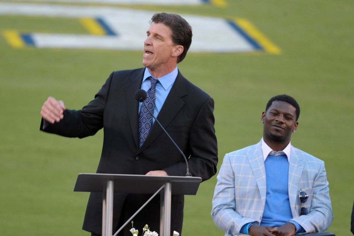 May 10, 2012; San Diego, CA, USA; San Diego Chargers former linebacker Billy Ray Smith speaks as LaDainian Tomlinson listens at the Celebration of Life for Junior Seau at Qualcomm Stadium. Mandatory Credit: Kirby Lee/Image of Sport-Imagn Images