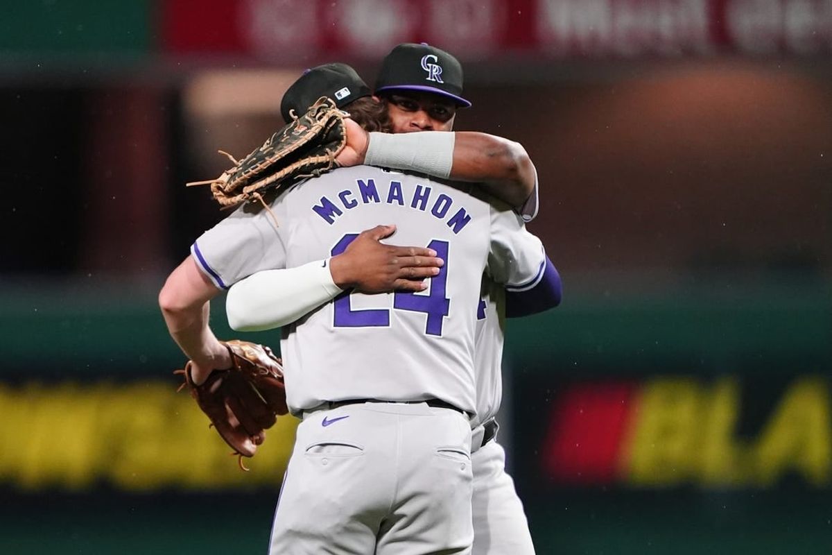 May 3, 2024; Pittsburgh, Pennsylvania, USA; Colorado Rockies shortstop Ezequiel Tovar (14) and first baseman Elehuris Montero (44) embrace to celebrate the victory against the Pittsburgh Pirates after the ninth inning at PNC Park.