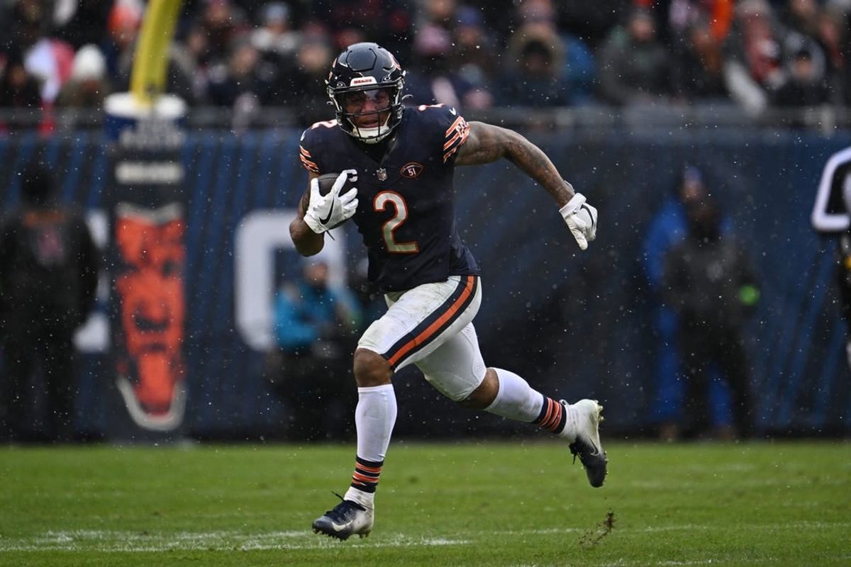 Dec 31, 2023; Chicago, Illinois, USA;  Chicago Bears wide receiver DJ Moore (2) runs with the ball after a catch in the second half against the Atlanta Falcons at Soldier Field.