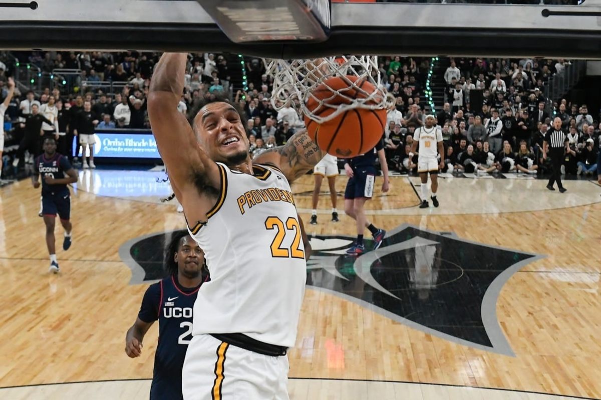 Mar 9, 2024; Providence, Rhode Island, USA; Providence Friars guard Devin Carter (22)  dunks the ball against the Connecticut Huskies during the first half at Amica Mutual Pavilion.