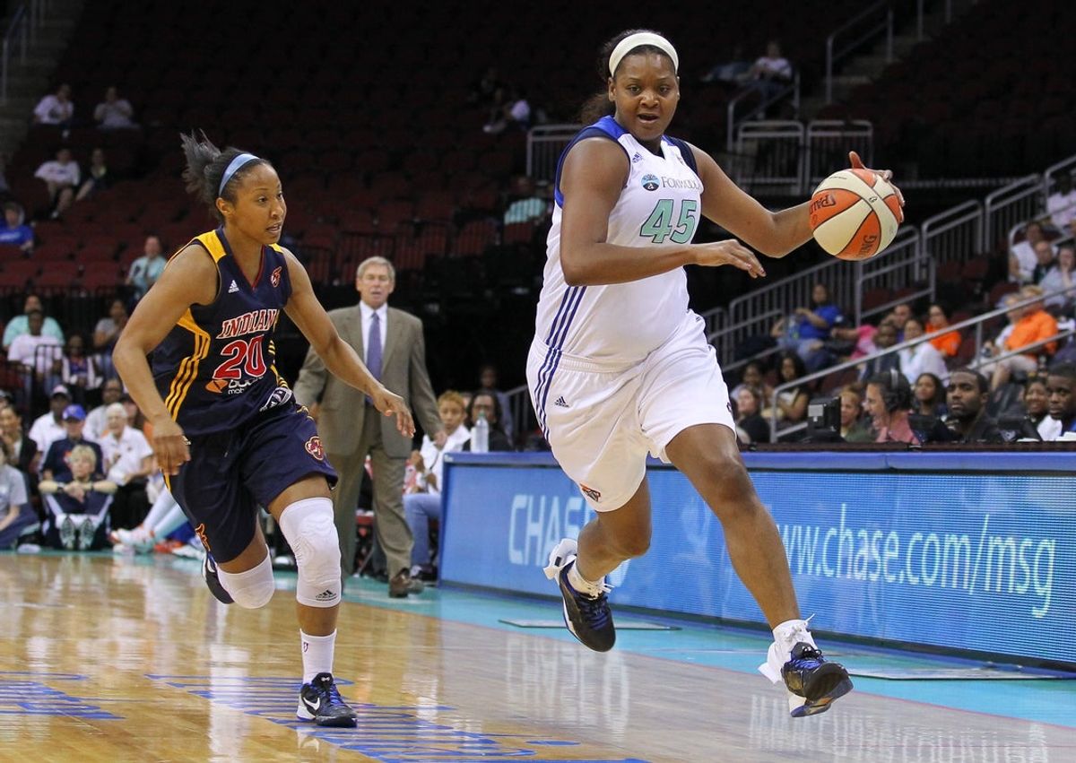 June 3, 2012; Newark, NJ, USA; New York Liberty forward Kara Braxton (45) dribbles the ball while being defended by Indiana Fever guard Briann January (20) during the first half at the Prudential Center. Mandatory Credit: Ed Mulholland-Imagn Images