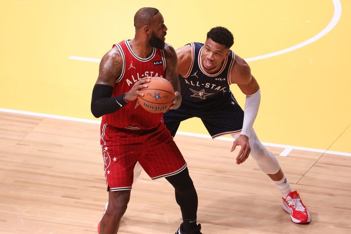 Feb 18, 2024; Indianapolis, Indiana, USA; Eastern Conference forward Giannis Antetokounmpo (34) of the Milwaukee Bucks defends Western Conference forward LeBron James (23) of the Los Angeles Lakers during the first quarter in the 73rd NBA All Star game at Gainbridge Fieldhouse.