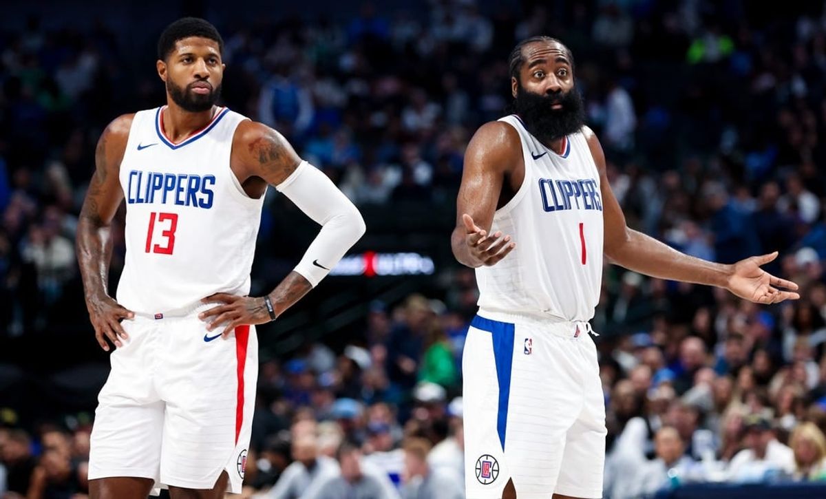 Nov 10, 2023; Dallas, Texas, USA;  LA Clippers guard James Harden (1) and LA Clippers forward Paul George (13) react against during the second half against the Dallas Mavericks at American Airlines Center.