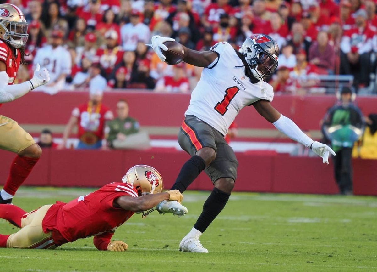 Nov 19, 2023; Santa Clara, California, USA; San Francisco 49ers wide receiver Isaiah Winstead (2) holds onto the ankle of Tampa Bay Buccaneers running back Rachaad White (1) during the fourth quarter at Levi's Stadium.