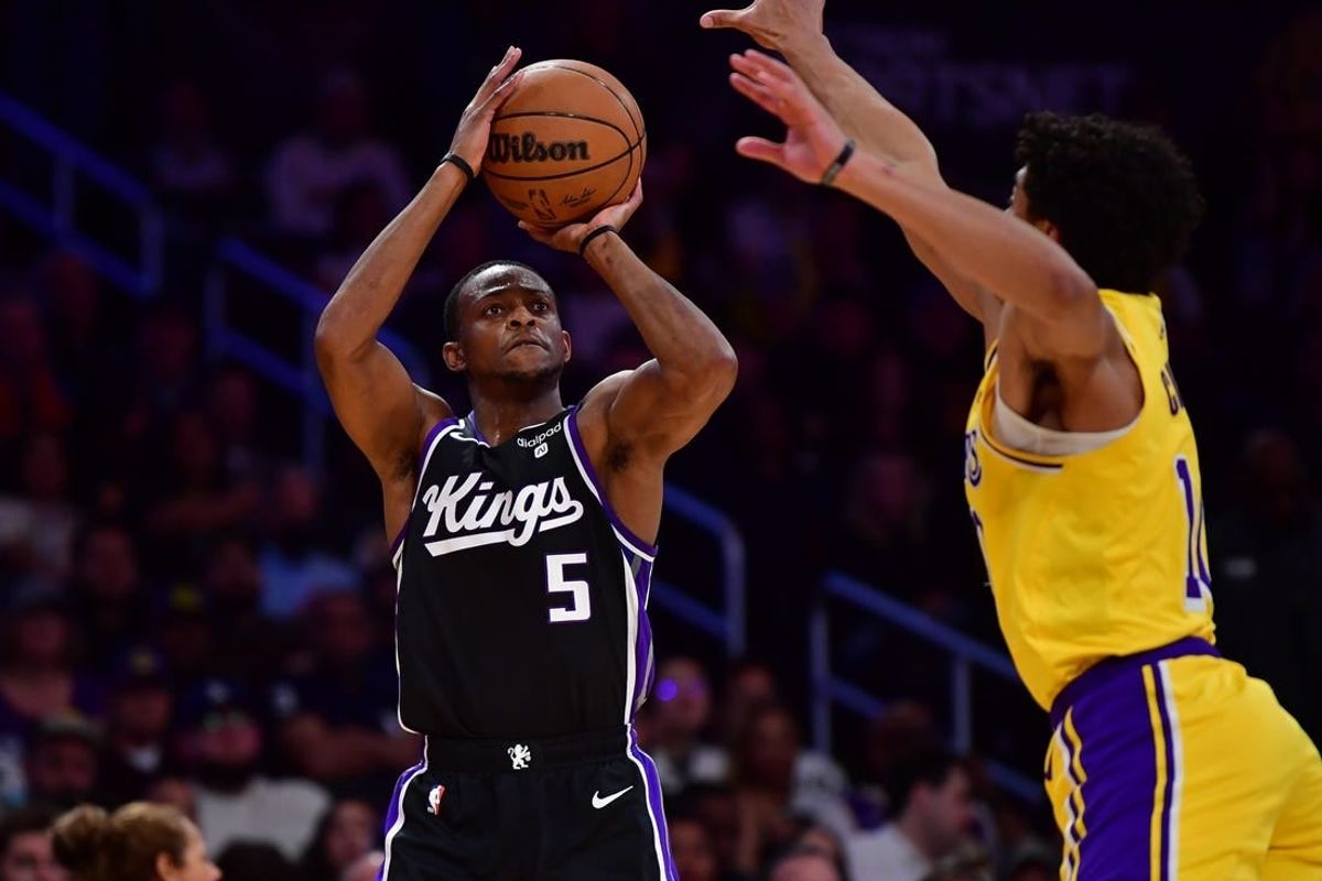 Mar 6, 2024; Los Angeles, California, USA; Sacramento Kings guard De'Aaron Fox (5) shoots against Los Angeles Lakers guard Max Christie (10) during the first half at Crypto.com Arena.