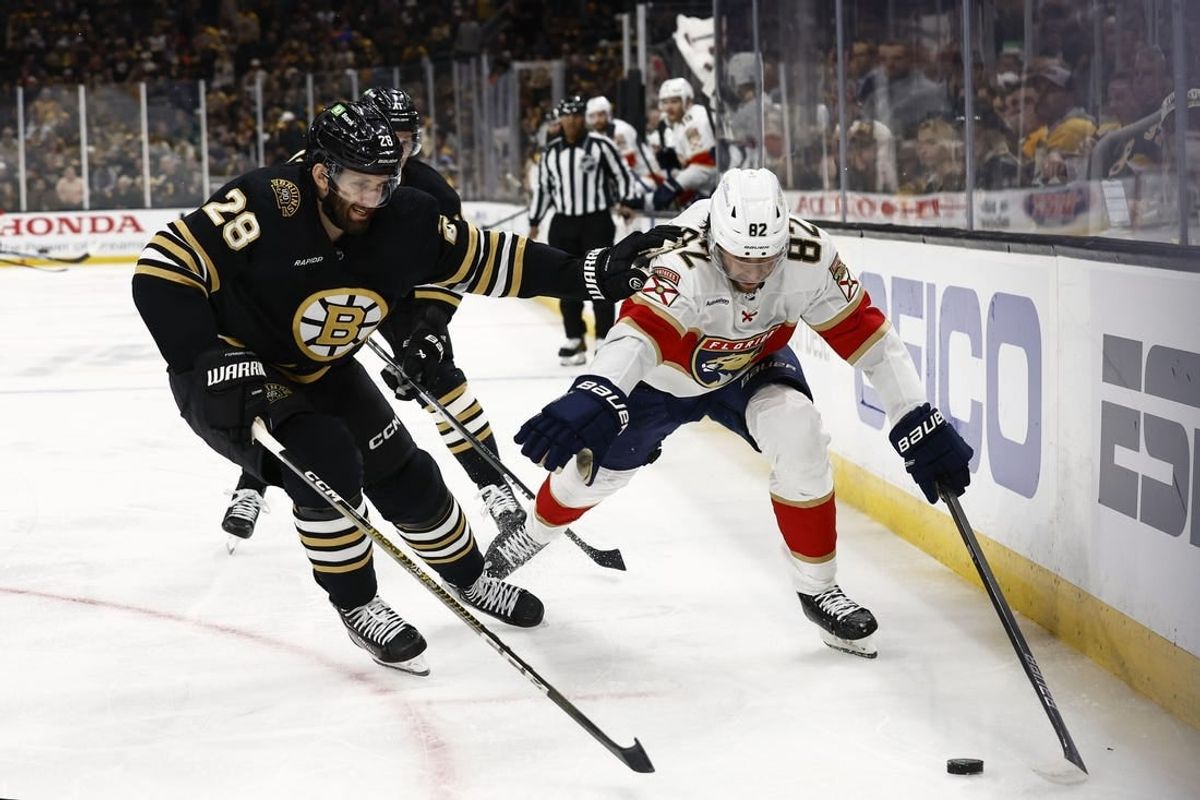 May 10, 2024; Boston, Massachusetts, USA; Florida Panthers center Kevin Stenlund (82) tries to get around Boston Bruins defenseman Derek Forbort (28) during the second period of game three of the second round of the 2024 Stanley Cup Playoffs at TD Garden.