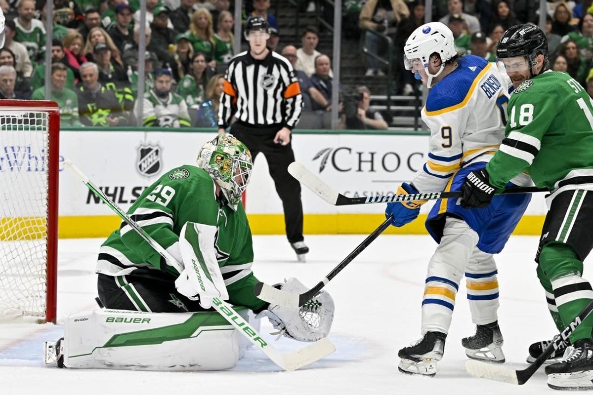 Apr 9, 2024; Dallas, Texas, USA; Buffalo Sabres left wing Zach Benson (9) attempts to redirect the puck past Dallas Stars goaltender Jake Oettinger (29) during the first period at the American Airlines Center.