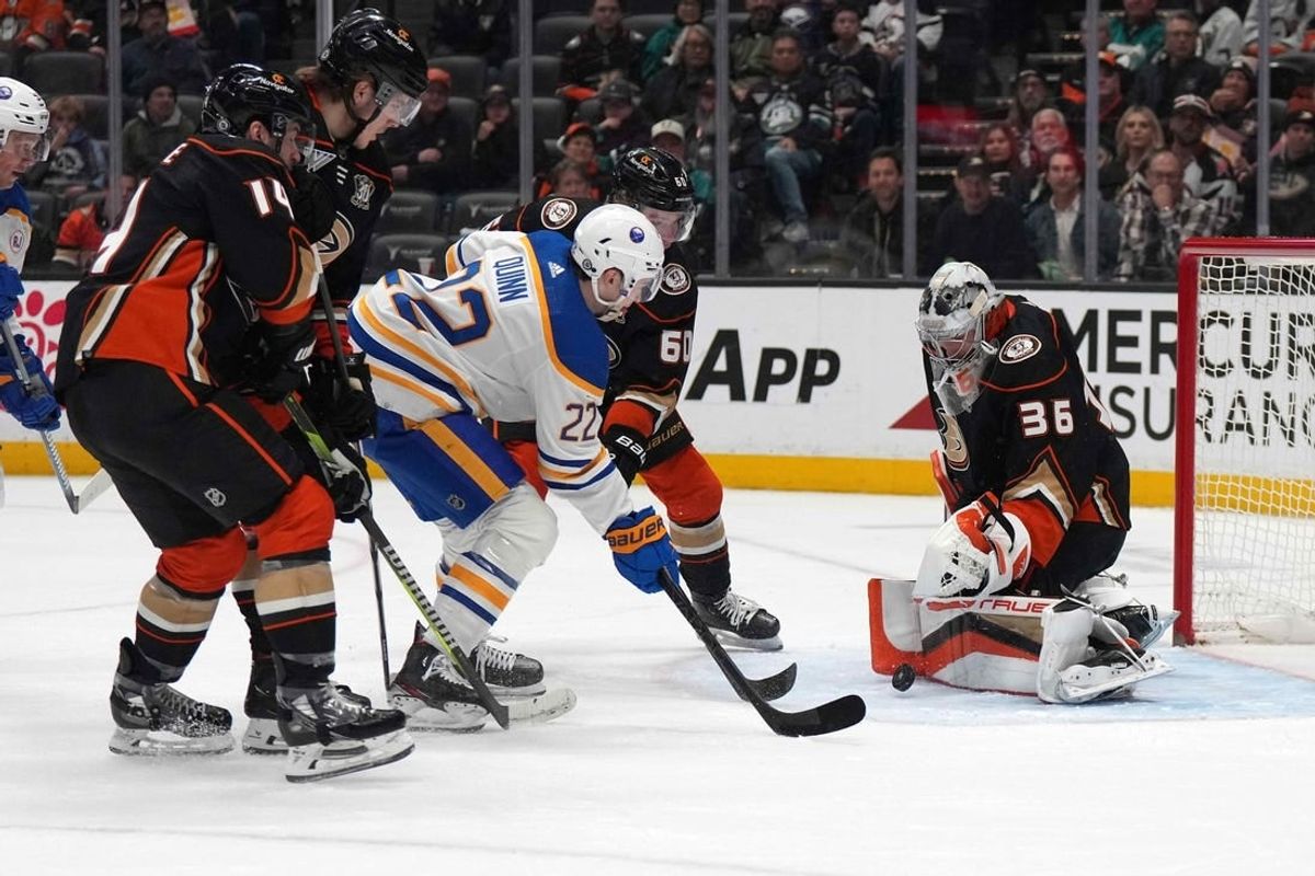 Jan 23, 2024; Anaheim, California, USA; Buffalo Sabres right wing Jack Quinn (22) shoots the puck against Anaheim Ducks goaltender John Gibson (36 at Honda Center.