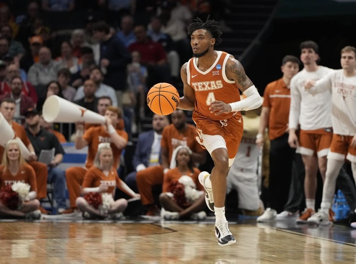 March 23, 2024, Charlotte, NC, USA; Texas Longhorns guard Tyrese Hunter (4) controls the ball against the Tennessee Volunteers in the second round of the 2024 NCAA Tournament at the Spectrum Center.