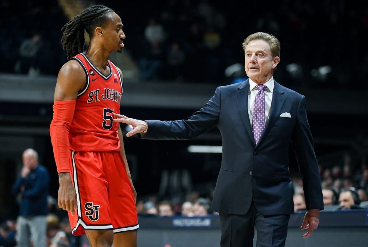 Feb 28, 2024; Indianapolis, Indiana, USA;  St. John's Red Storm guard Daniss Jenkins (5) talks with St. John's Red Storm head coach Rick Pitino during the second half at Hinkle Fieldhouse.