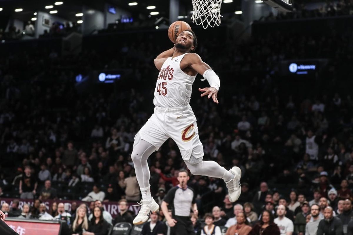 Feb 8, 2024; Brooklyn, New York, USA; Cleveland Cavaliers guard Donovan Mitchell (45) goes up for a dunk in the first quarter against the Brooklyn Nets at Barclays Center.
