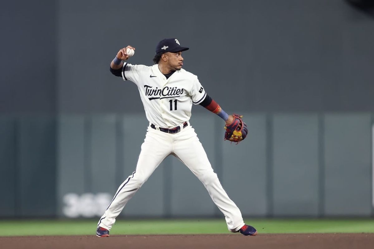 Oct 11, 2023; Minneapolis, Minnesota, USA; Minnesota Twins second baseman Jorge Polanco (11) throws to first for an out in the eighth inning against the Houston Astros during game four of the ALDS for the 2023 MLB playoffs at Target Field.