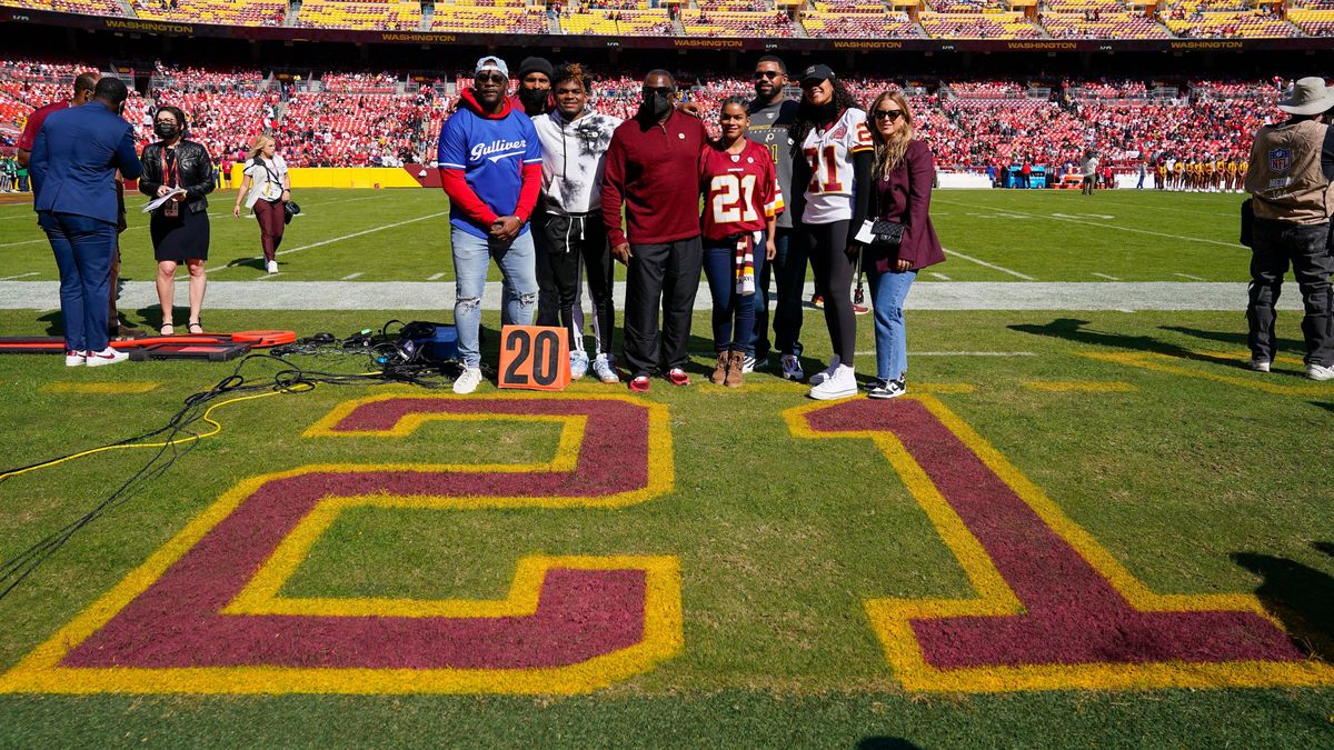Members of Sean Taylor’s family gather to celebrate his jersey retirement.