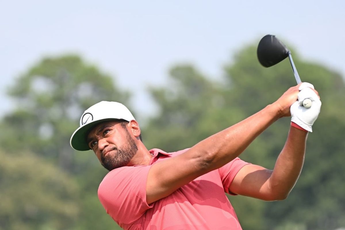 Aug 24, 2023; Atlanta, Georgia, USA; Tony Finau tees off on the 16th hole during the first round of the TOUR Championship golf tournament at East Lake Golf Club.