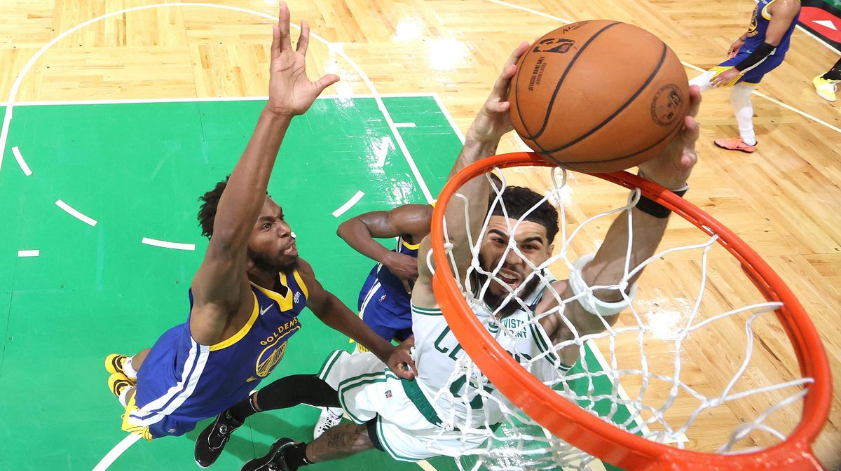 Jayson Tatum dunks against Andrew Wiggins in Game Six of the 2022 NBA Finals at TD Garden on June 16, 2022 in Boston, Massachusetts.