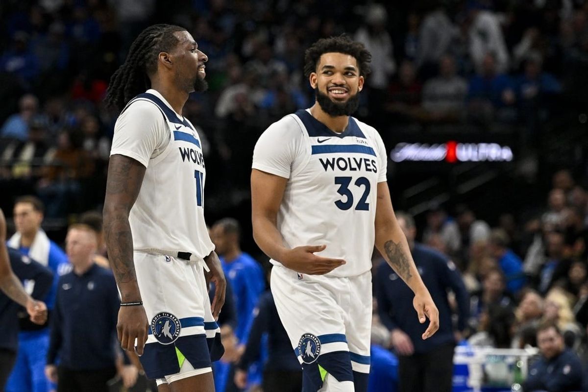 Dec 14, 2023; Dallas, Texas, USA; Minnesota Timberwolves center Naz Reid (11) and center Karl-Anthony Towns (32) walk off the court during the second half against the Dallas Mavericks at the American Airlines Center.