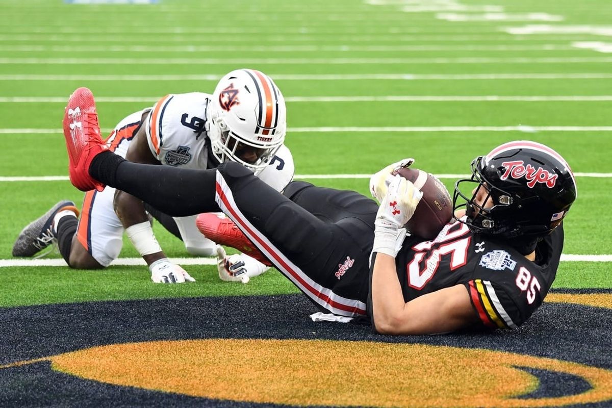 Dec 30, 2023; Nashville, TN, USA; Maryland Terrapins tight end Preston Howard (85) catches a touchdown pass against Auburn Tigers linebacker Eugene Asante (9) during the first half at Nissan Stadium.