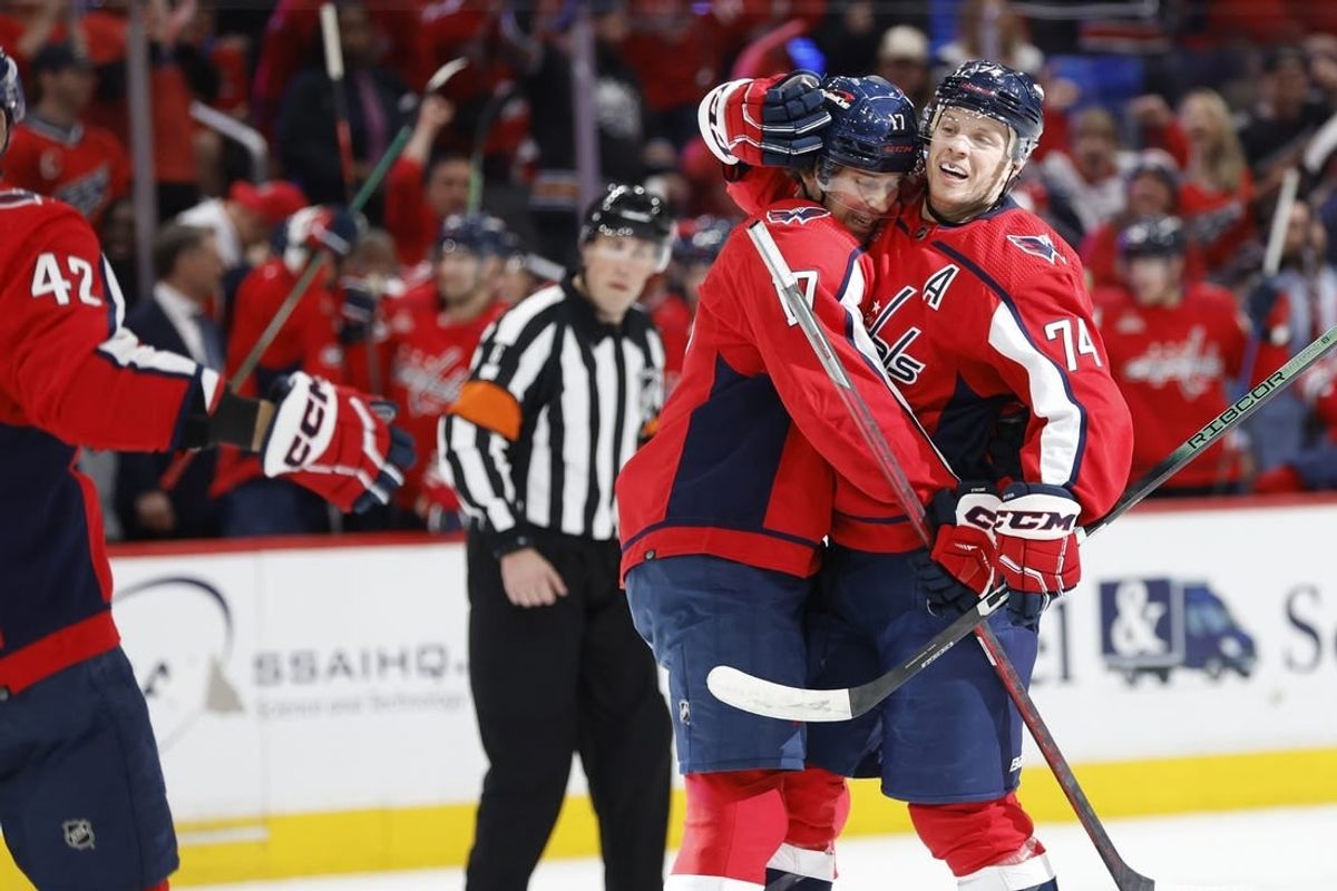 Apr 15, 2024; Washington, District of Columbia, USA; Washington Capitals defenseman John Carlson (74) celebrates with Capitals center Dylan Strome (17) after scoring a goal against the Boston Bruins in the first period at Capital One Arena.