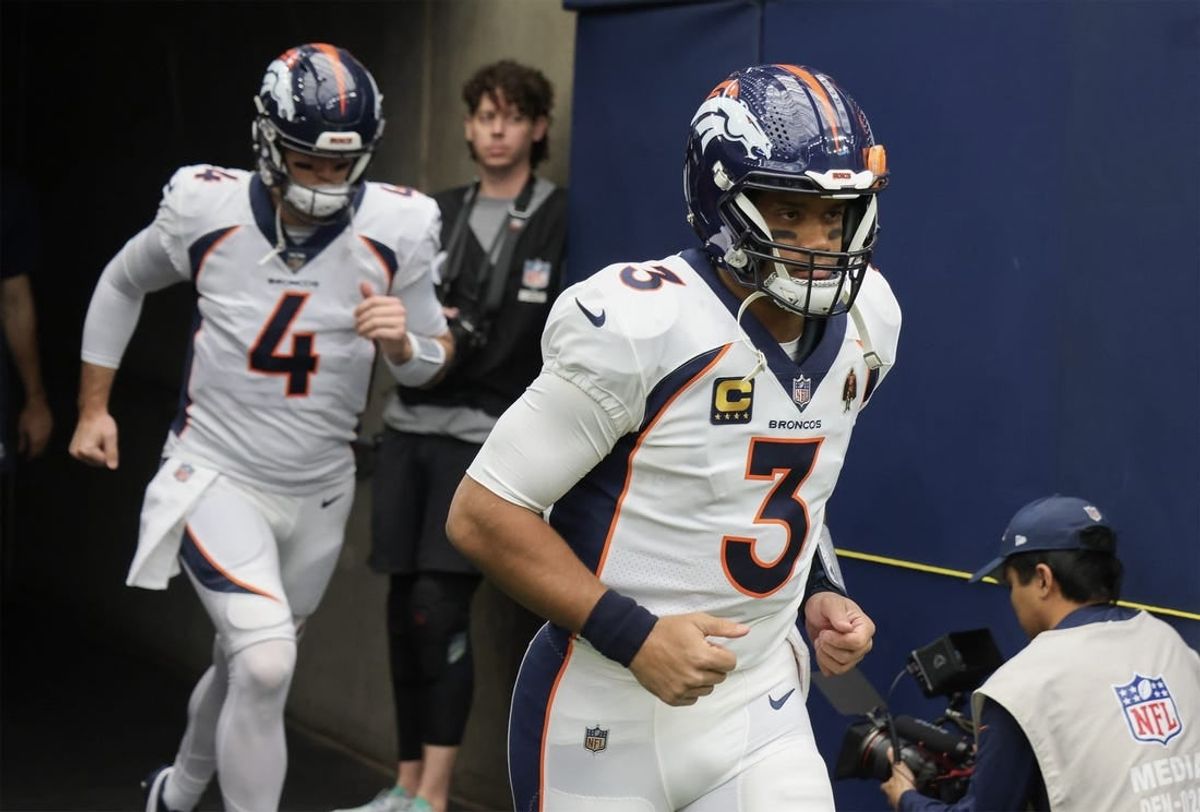 Dec 3, 2023; Houston, Texas, USA; Denver Broncos quarterback Russell Wilson (3) and quarterback Jarrett Stidham (4) run out on the field before playing against the Houston Texans at NRG Stadium.