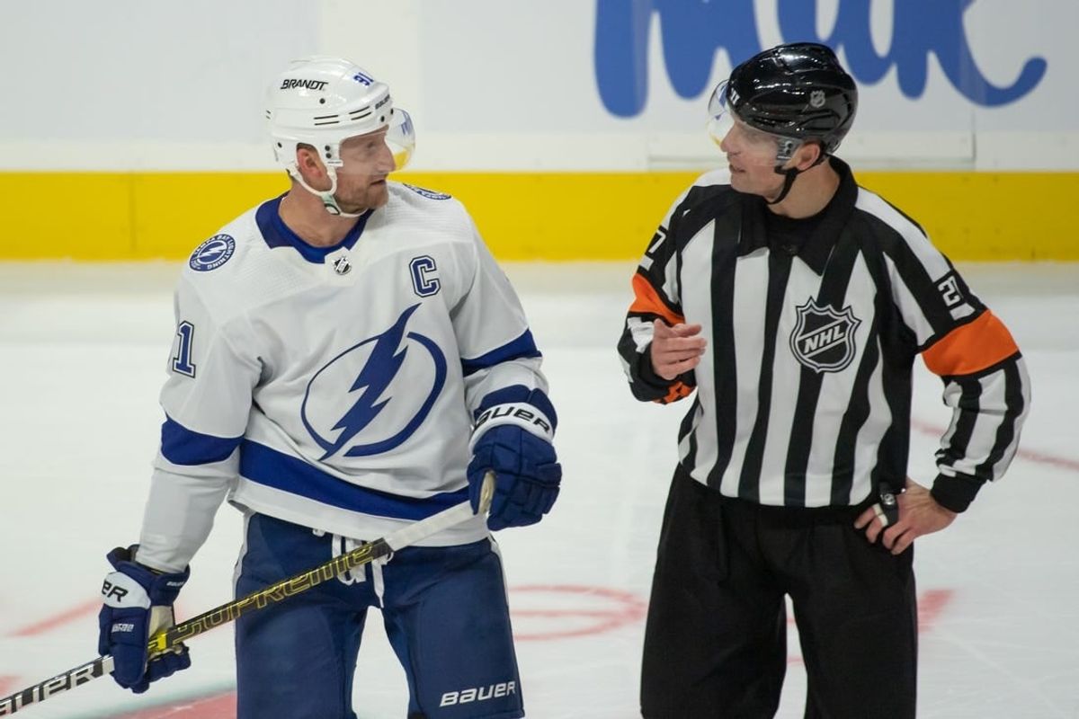 Nov 4, 2023; Ottawa, Ontario, CAN; Tampa Bay Lightning center Steven Stamkos (91) speaks with NHL referee Eric Furlatt (27) in the third period against the Ottawa Senators at the Canadian Tire Centre.