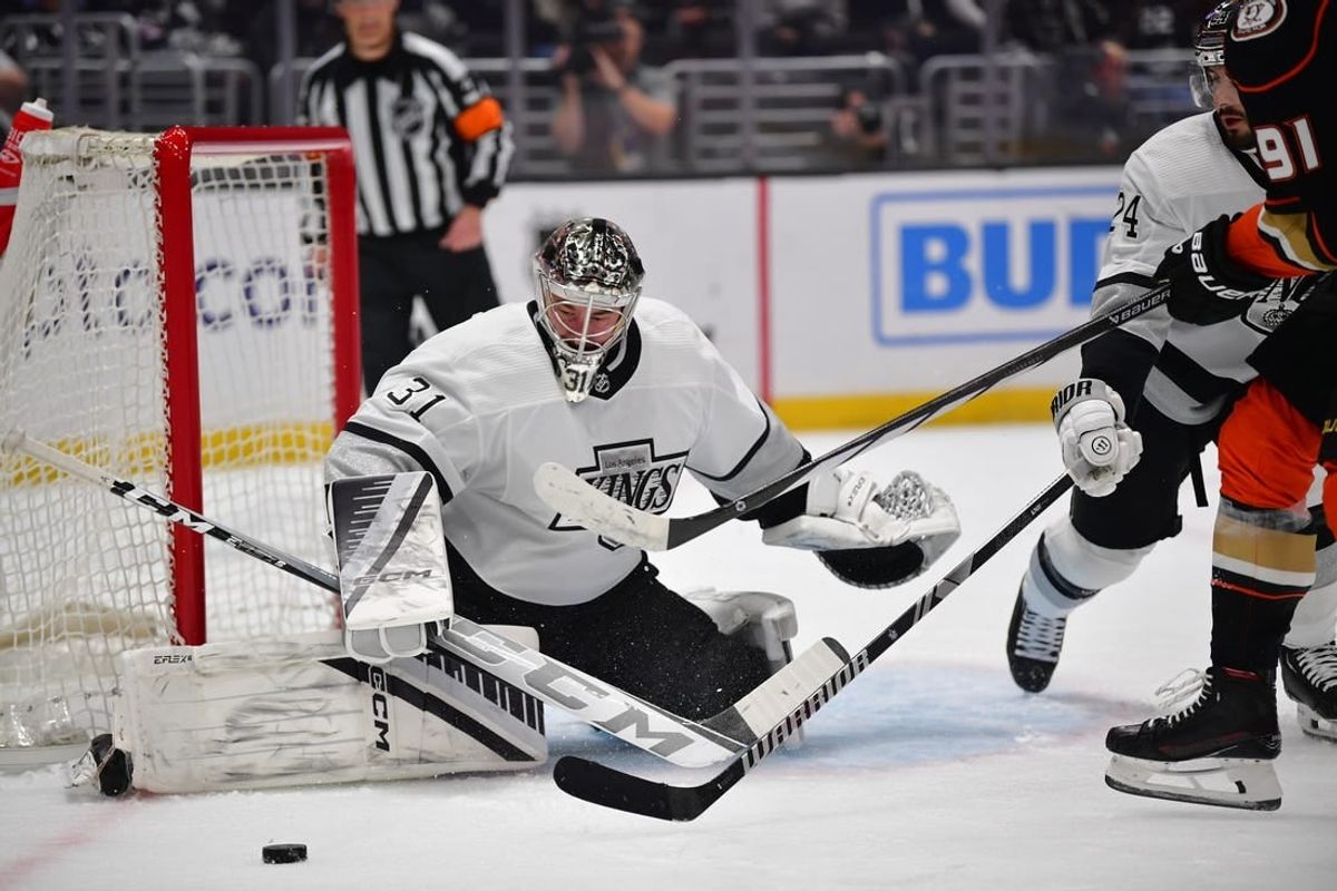Feb 24, 2024; Los Angeles, California, USA;  Los Angeles Kings goaltender David Rittich (31) defends the goal against Anaheim Ducks center Leo Carlsson (91) during the first period at Crypto.com Arena.