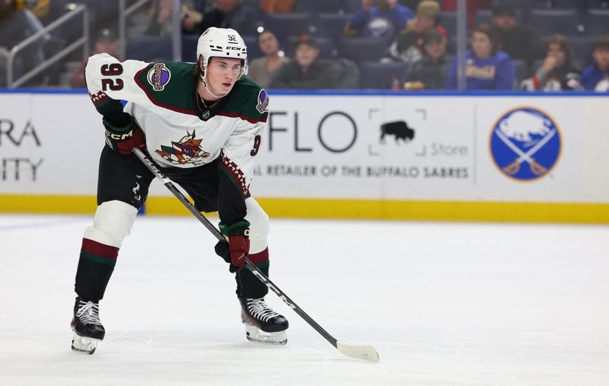Dec 11, 2023; Buffalo, New York, USA;  Arizona Coyotes center Logan Cooley (92) waits for the face-off during the third period against the Buffalo Sabres at KeyBank Center.