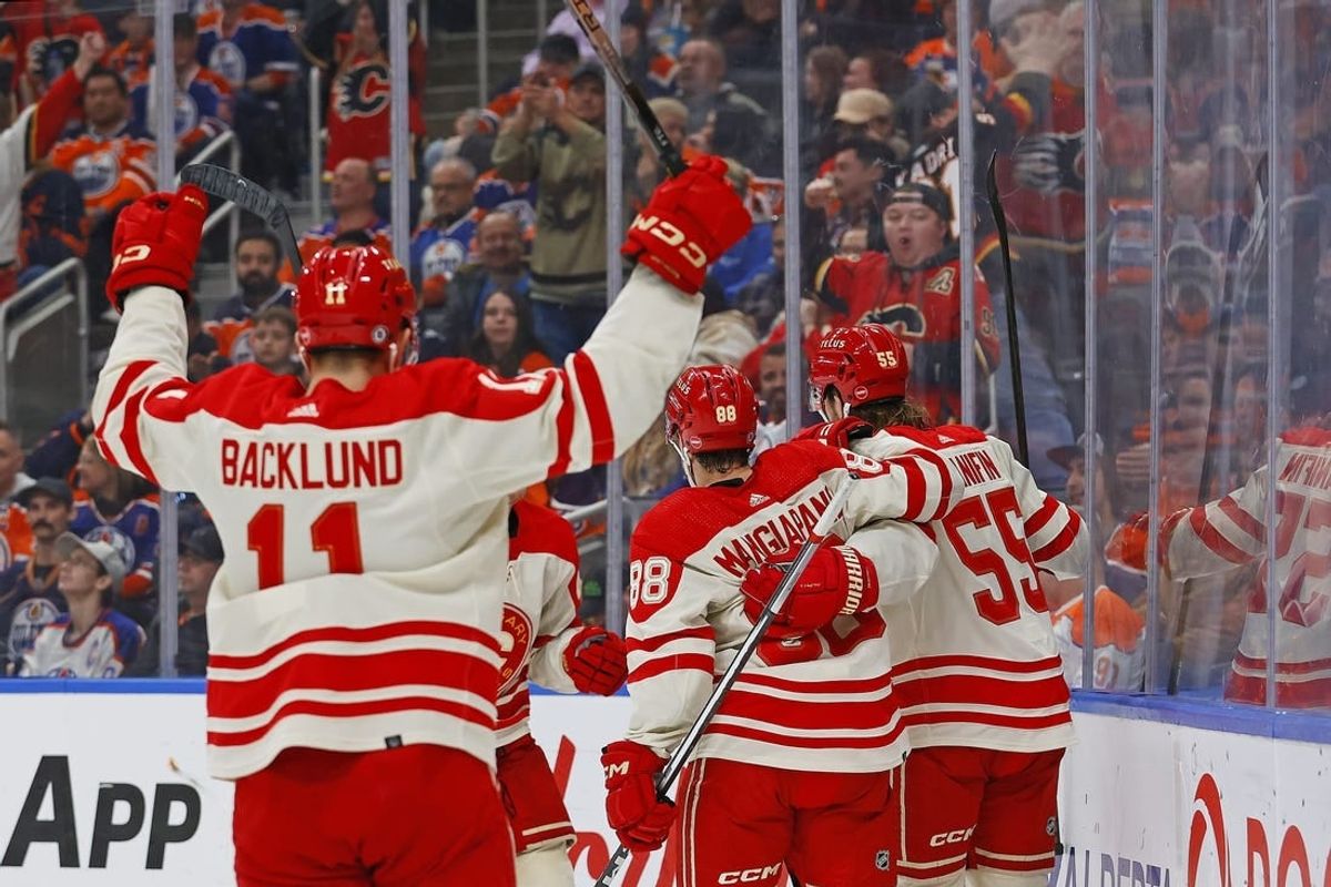 Feb 24, 2024; Edmonton, Alberta, CAN; The Calgary Flames celebrate a goal scored by defensemen Noah Hanifin (55) during the second period against the Edmonton Oilers at Rogers Place.