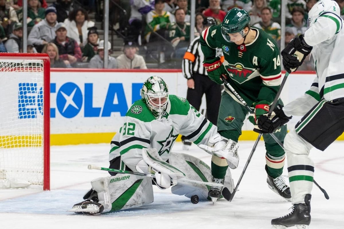 Jan 8, 2024; Saint Paul, Minnesota, USA; Dallas Stars goaltender Matt Murray (32) makes a save on Minnesota Wild center Joel Eriksson Ek (14) in the second period at Xcel Energy Center.