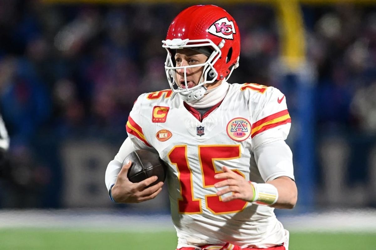 Jan 21, 2024; Orchard Park, New York, USA; Kansas City Chiefs quarterback Patrick Mahomes (15) runs with the ball against the Buffalo Bills in the second half of the 2024 AFC divisional round game at Highmark Stadium.
