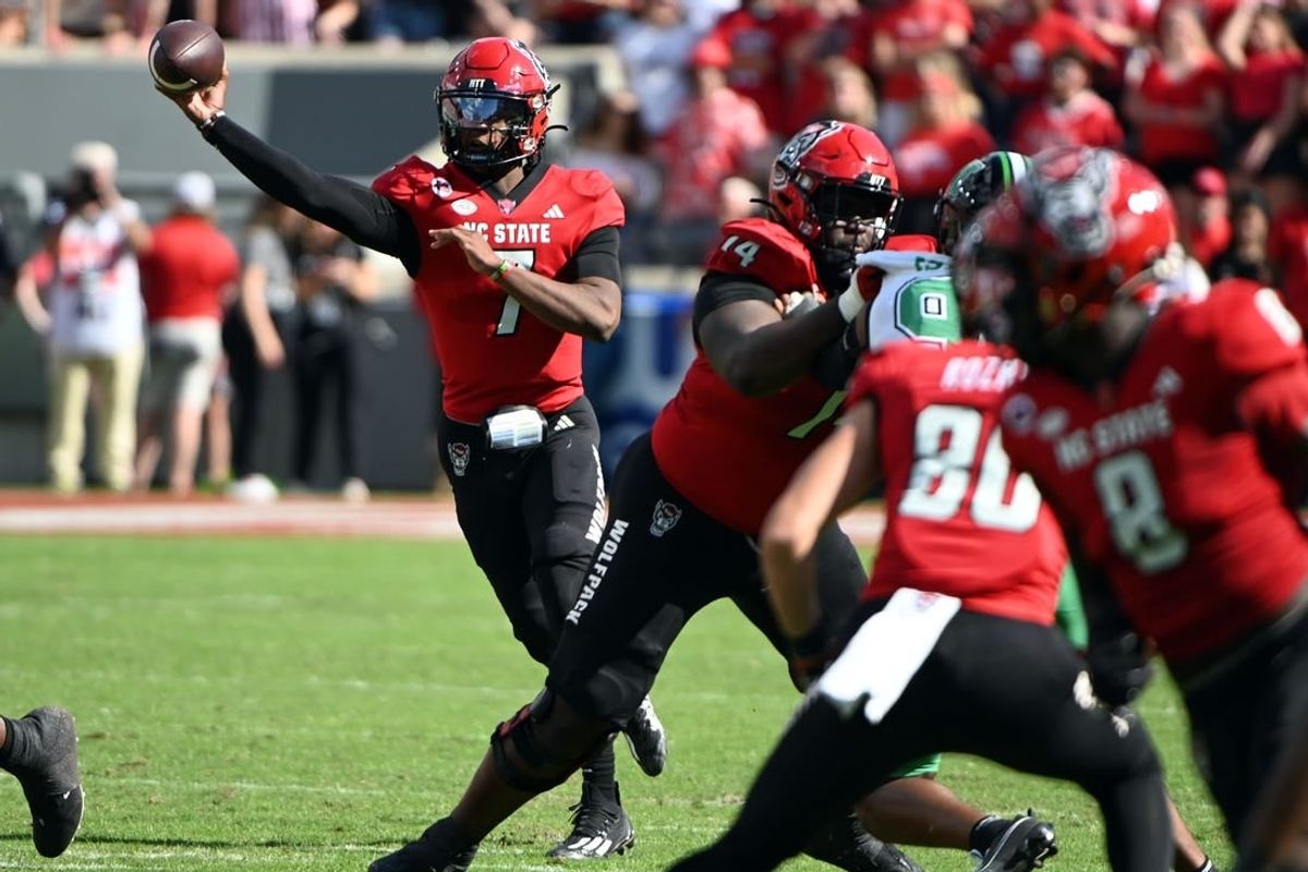 Oct 7, 2023; Raleigh, North Carolina, USA; North Carolina State Wolfpack quarterback MJ Morris (7) throws a pass during the first half against the Marshall Thundering Herd at Carter-Finley Stadium.