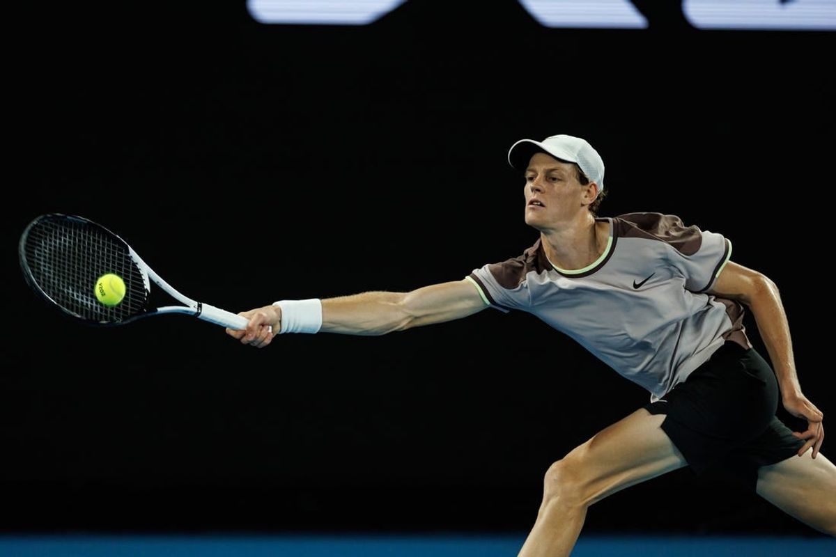 Jan 23, 2024; Melbourne, Victoria, Australia;  Jannik Sinner of Italy in action against Andrey Rublev of Russia in the quarter final of the men s singles.