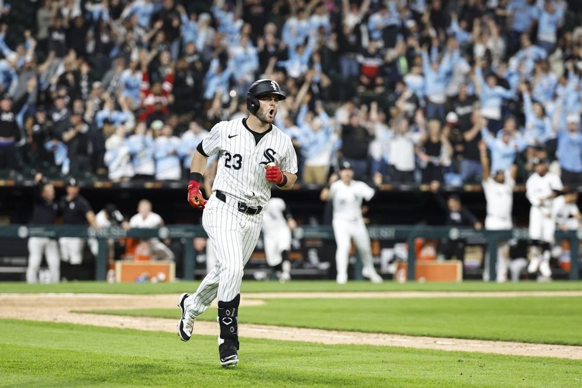 Apr 27, 2024; Chicago, Illinois, USA; Chicago White Sox outfielder Andrew Benintendi (23) celebrates after hitting a two-run walk-off against the Tampa Bay Rays during the 10th inning at Guaranteed Rate Field.