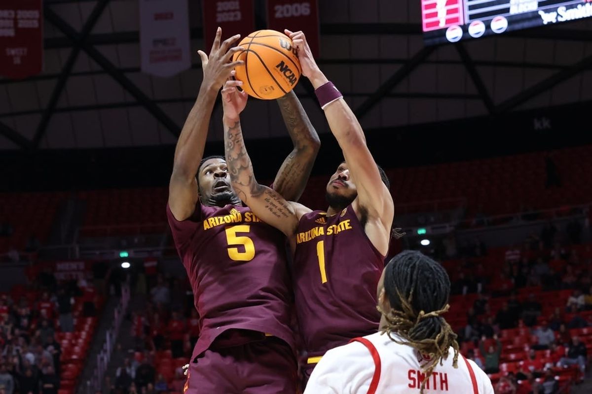 Feb 10, 2024; Salt Lake City, Utah, USA; Arizona State Sun Devils guard Jamiya Neal (5) and guard Frankie Collins (1) battle for a rebound against the Utah Utes during the second half at Jon M. Huntsman Center.