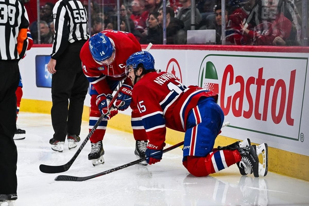 Nov 30, 2023; Montreal, Quebec, CAN; Montreal Canadiens center Alex Newhook (15) gets injured on a play against the Florida Panthers during the third period at Bell Centre.