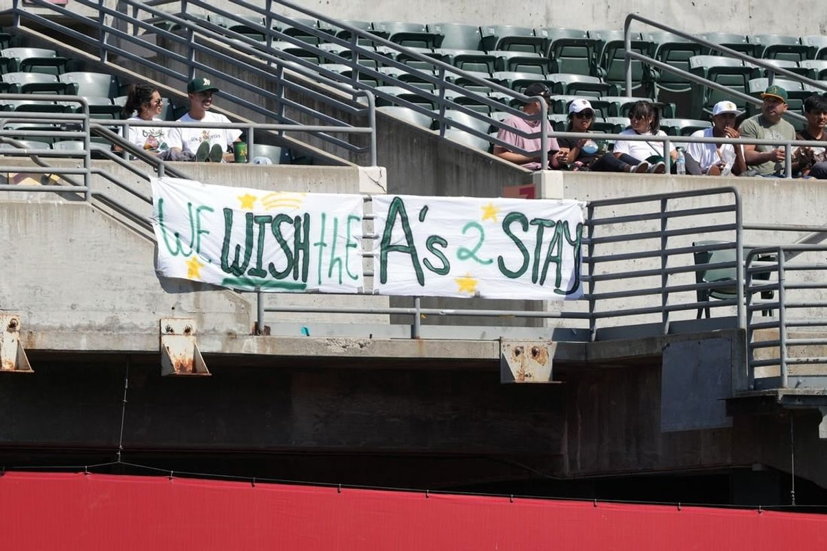 Sep 17, 2023; Oakland, California, USA; Oakland Athletics fans hang a sign in the right field bleachers during the fourth inning against the San Diego Padres at Oakland-Alameda County Coliseum.