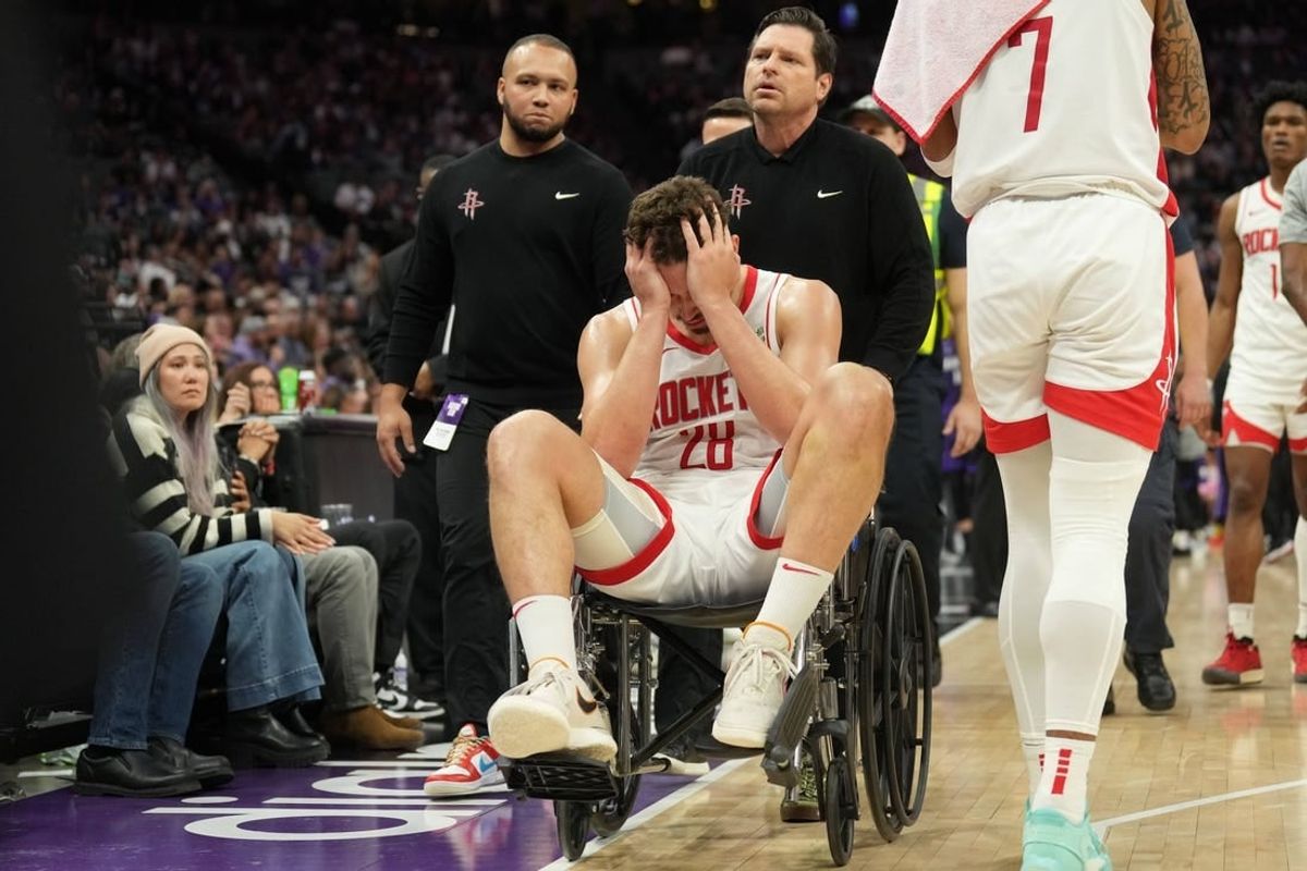Mar 10, 2024; Sacramento, California, USA; Houston Rockets center Alperen Sengun (28) is wheeled off of the court after suffering an injury against the Sacramento Kings during the fourth quarter at Golden 1 Center.