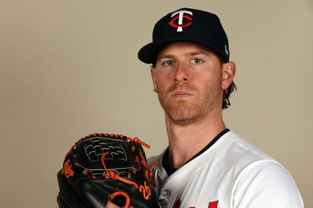 Feb 22, 2024; Lee County, FL, USA;  Minnesota Twins starting pitcher Anthony DeSclafani (21) poses for a photo during photo day at Hammond Stadium.