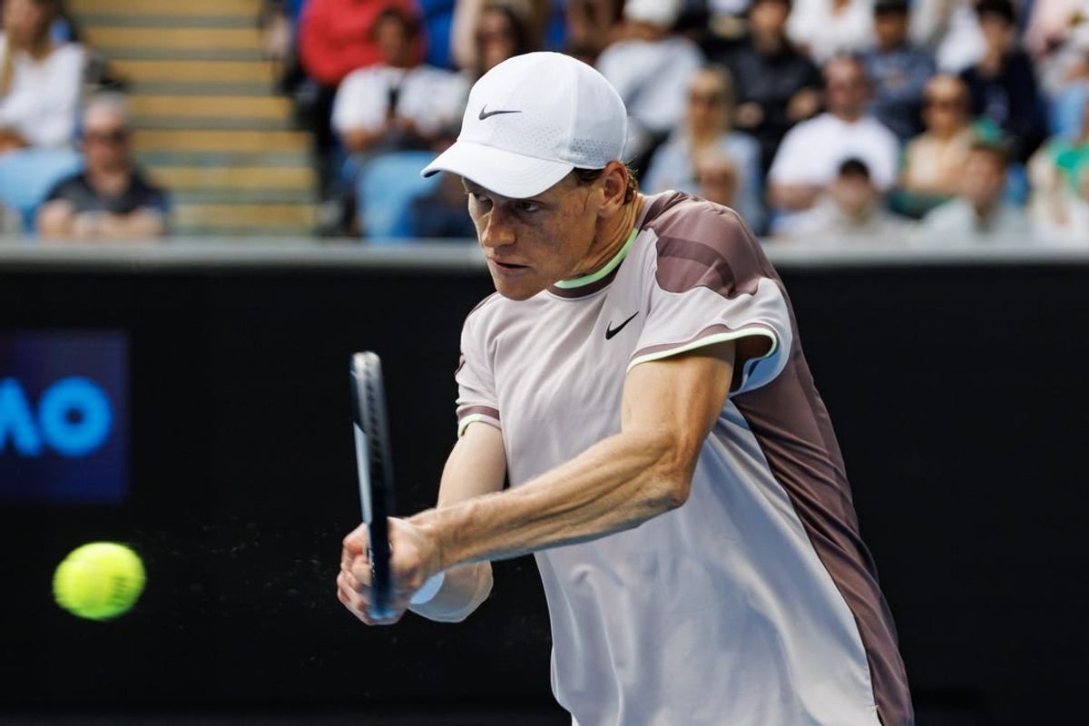Jan 21, 2024; Melbourne, Victoria, Australia;  Janik Sinner of Italy hits a shot against Karen Kachanov of Russia in the forth round of the men s singles at the Australian Open 2024.