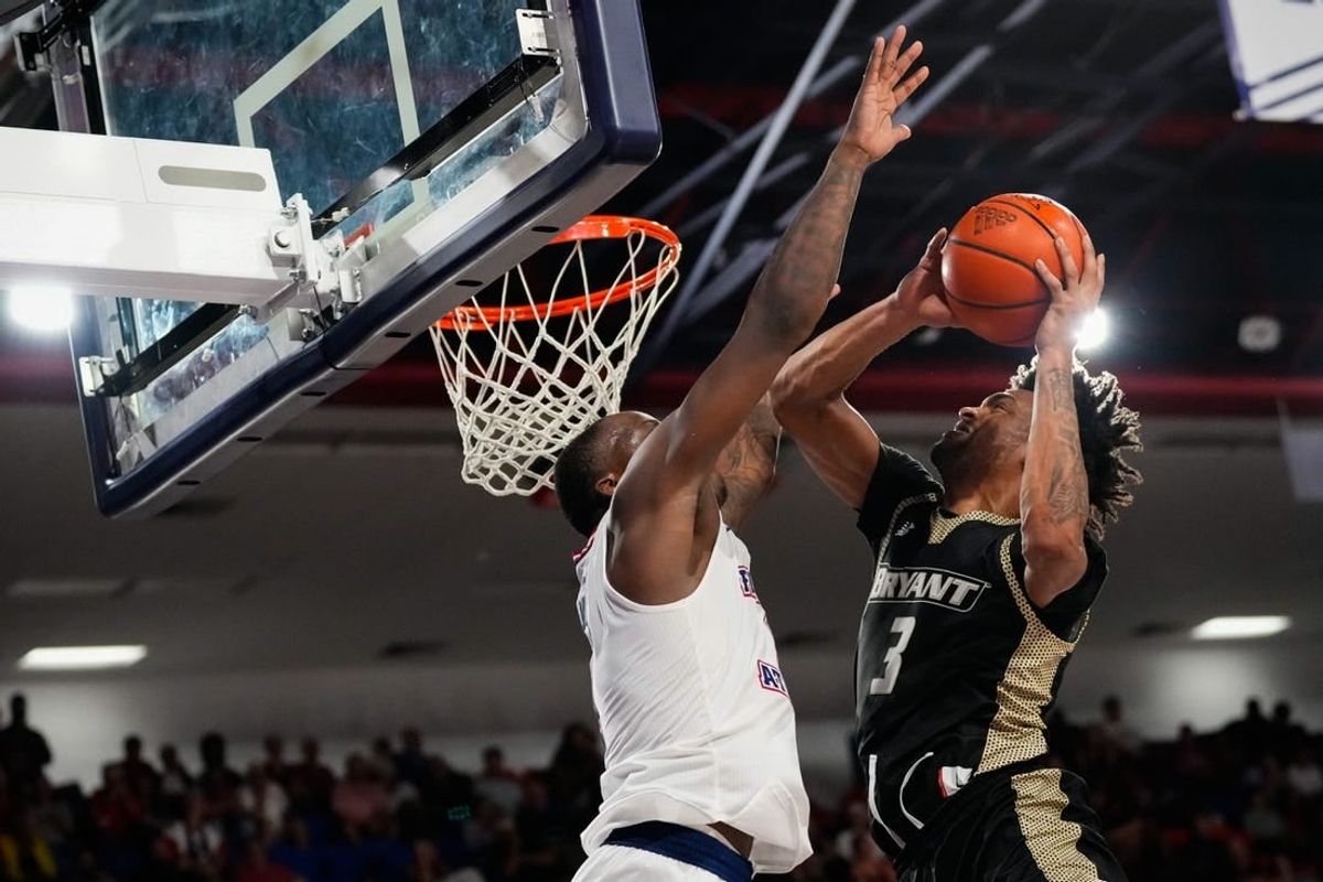 Nov 18, 2023; Boca Raton, Florida, USA;  Bryant University Bulldogs guard Sherif Gross-Bullock (3) shoots against Florida Atlantic Owls guard Johnell Davis (1) during the second half at Eleanor R. Baldwin Arena.