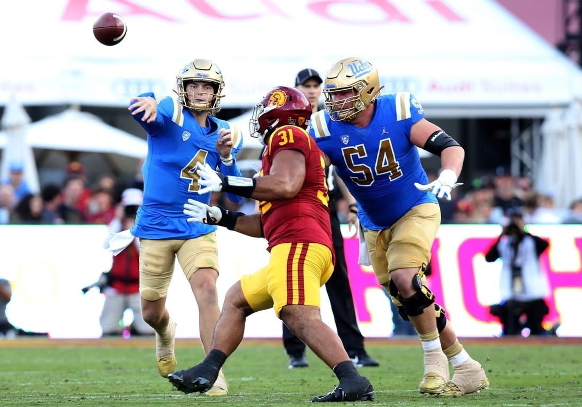 Nov 18, 2023; Los Angeles, California, USA; UCLA Bruins quarterback Ethan Garbers (4) throws during the second quarter against the USC Trojans at United Airlines Field at Los Angeles Memorial Coliseum.
