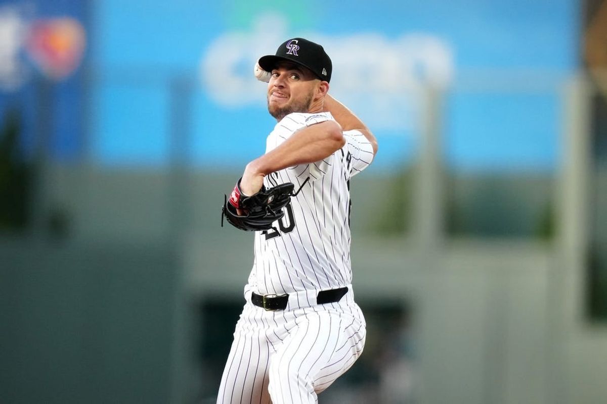 Apr 21, 2024; Denver, Colorado, USA; Colorado Rockies pitcher Peter Lambert (20) delivers a pitch in the first inning against the Seattle Mariners at Coors Field.