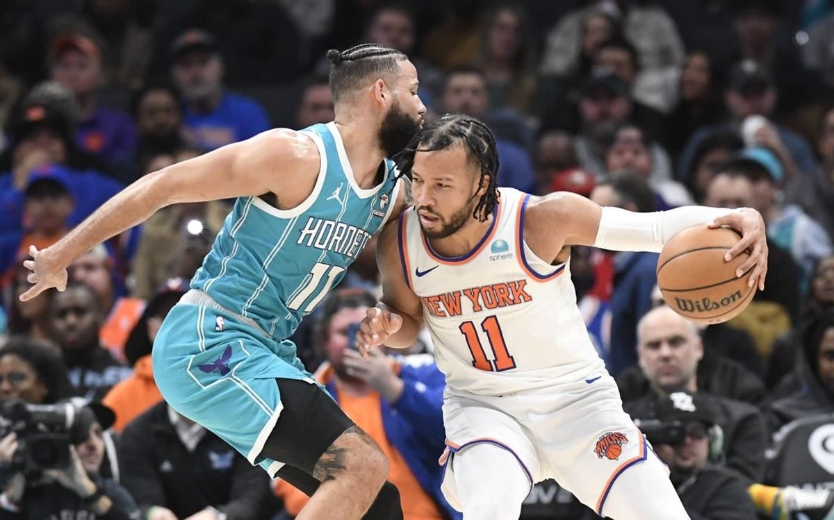 Jan 29, 2024; Charlotte, North Carolina, USA;  New York Knicks guard Jalen Brunson (11) moves into Charlotte Hornets forward Cody Martin (11) during the second half at the Spectrum Center.