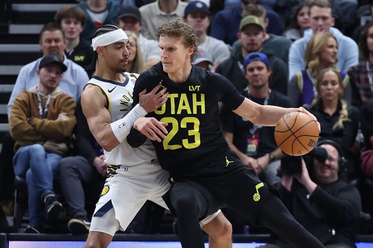 Jan 15, 2024; Salt Lake City, Utah, USA; Utah Jazz forward Lauri Markkanen (23) dribbles against Indiana Pacers guard Andrew Nembhard (2) during the first quarter at Delta Center.