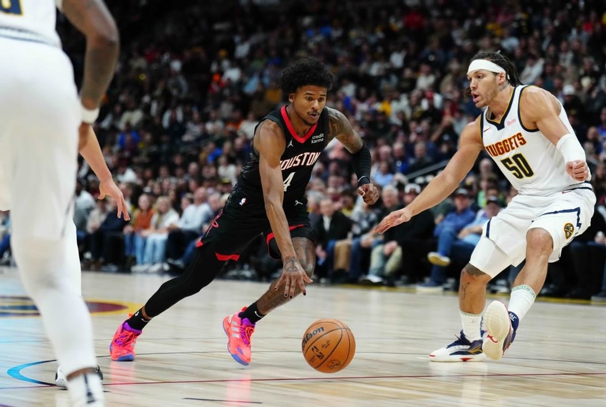 Dec 8, 2023; Denver, Colorado, USA; Houston Rockets guard Jalen Green (4) drives at Denver Nuggets forward Aaron Gordon (50) in the first quarter at Ball Arena.