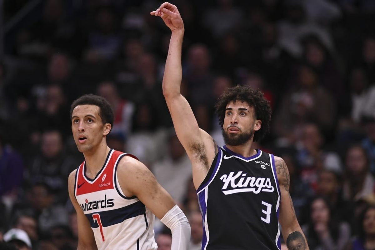 Mar 21, 2024; Washington, District of Columbia, USA;  Sacramento Kings guard Chris Duarte (3) follows through on a three point basket as Washington Wizards forward Patrick Baldwin Jr. (7) looks on during the first half at Capital One Arena.