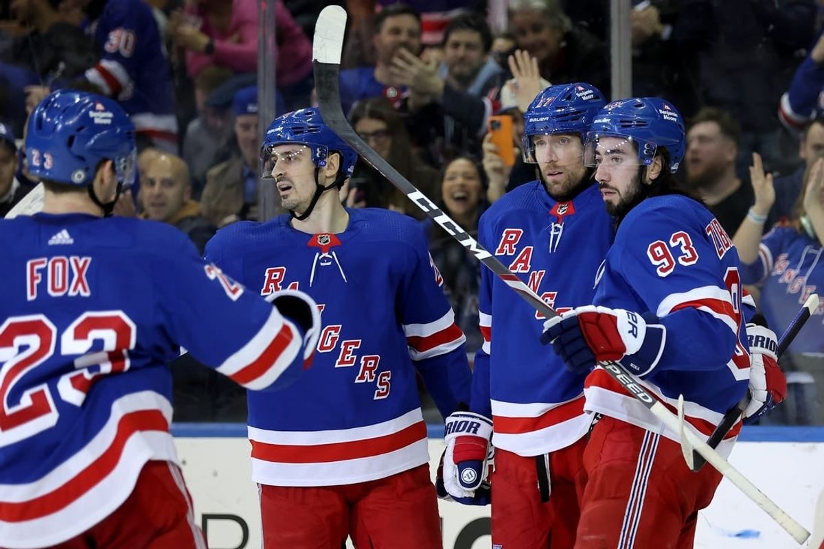 Jan 16, 2024; New York, New York, USA; New York Rangers right wing Blake Wheeler (17) celebrates his empty net goal against the Seattle Kraken with defenseman Adam Fox (23) and left wing Chris Kreider (20) and center Mika Zibanejad (93) during the third period at Madison Square Garden.