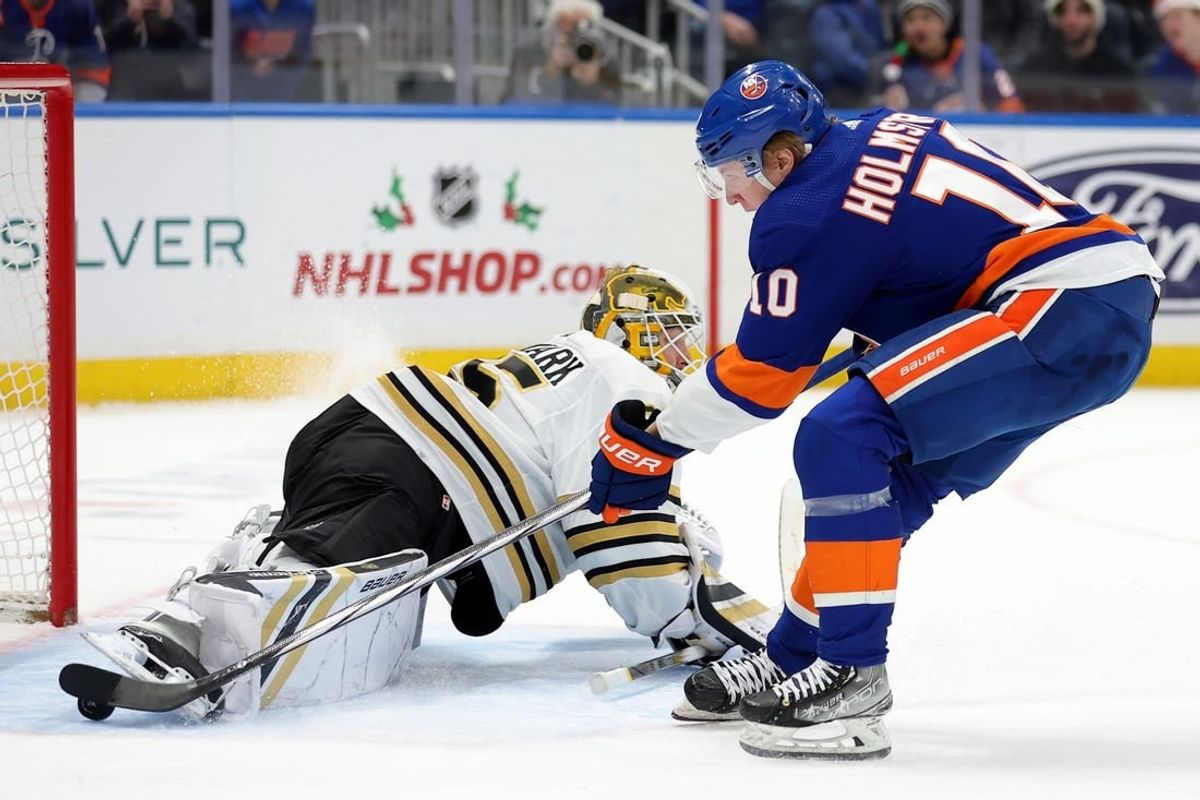 Dec 15, 2023; Elmont, New York, USA; New York Islanders right wing Simon Holmstrom (10) scores a goal against Boston Bruins goaltender Linus Ullmark (35) during the second period at UBS Arena.