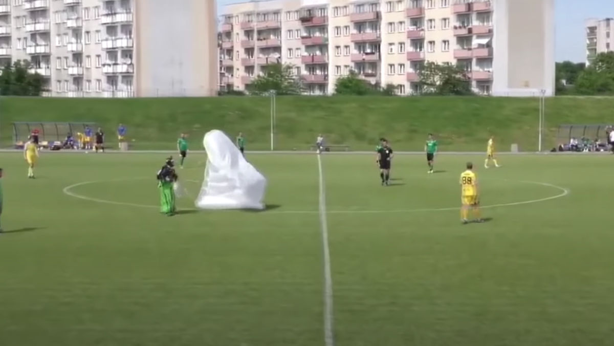 A parachuter landed in the middle of a soccer game in Poland.